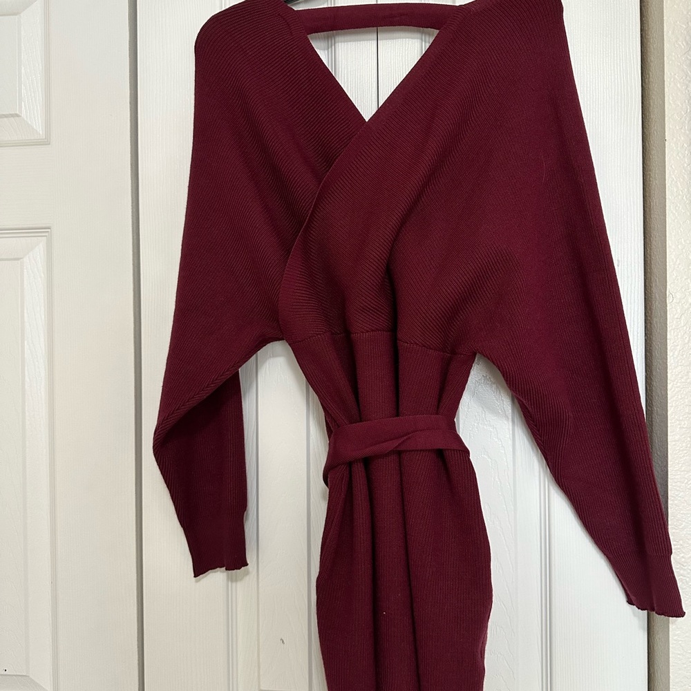 Brand new long sleeve sweater dress. Color is a deep maroon.